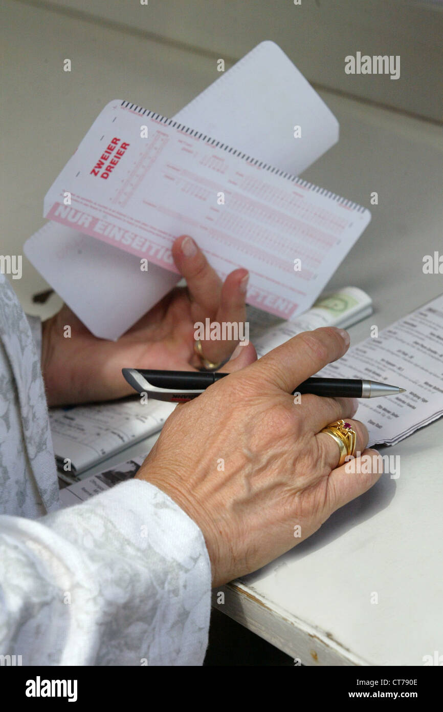 Symbol photo, players in completing a betting slip Stock Photo