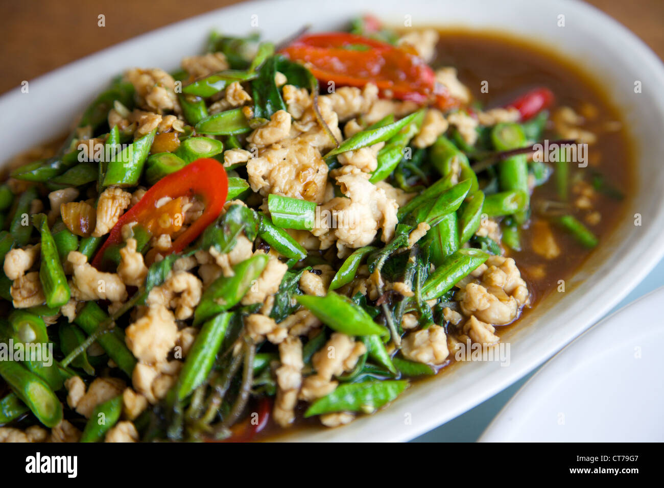 A Thai meal of Chicken basil leafs and green beans Stock Photo Alamy