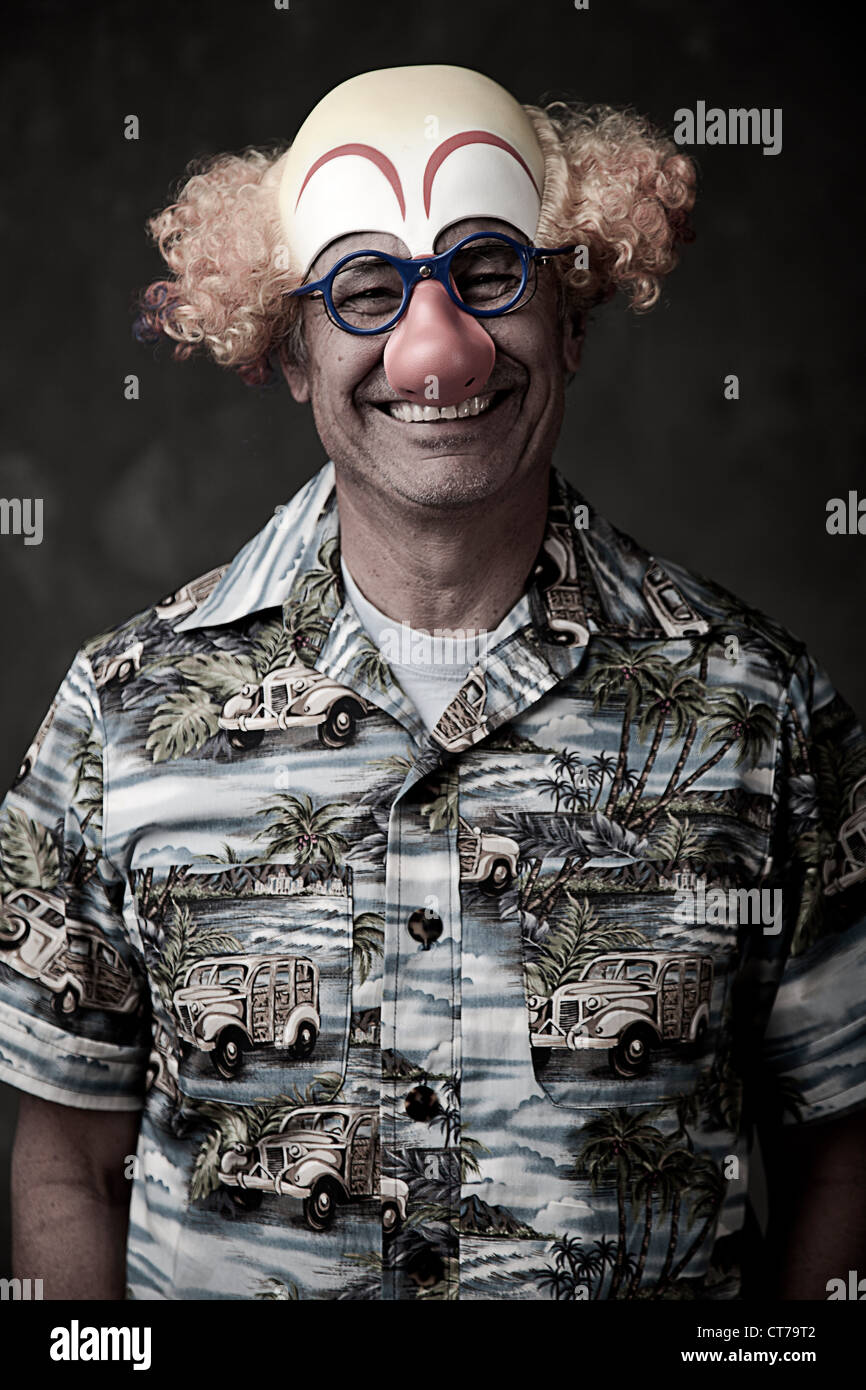 Portrait of a senior man wearing clown mask Stock Photo Alamy