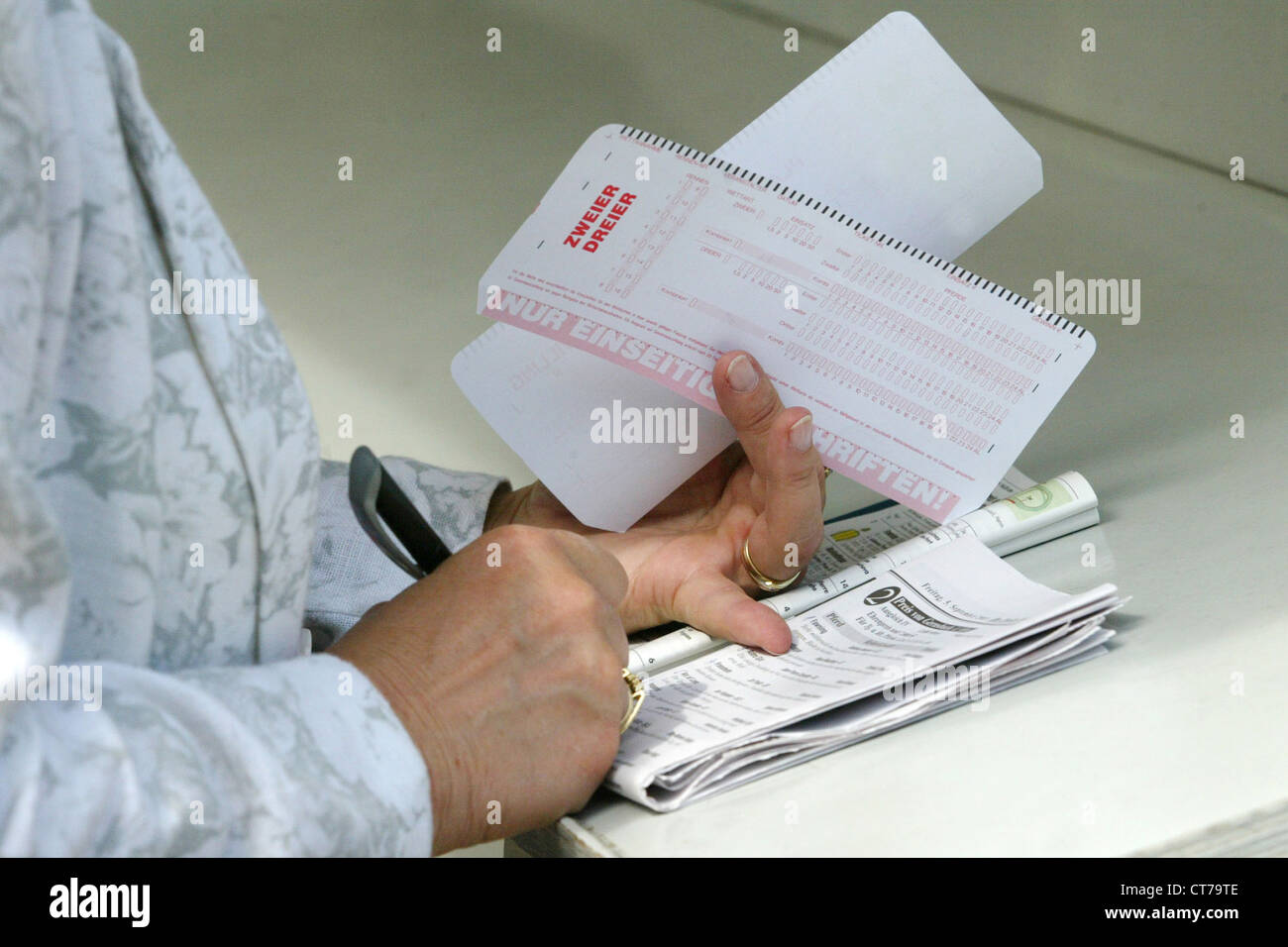 Symbol photo, players in completing a betting slip Stock Photo