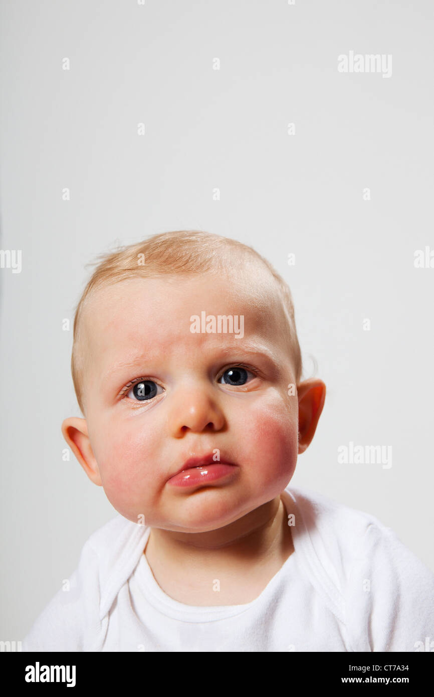 Confused looking baby boy Stock Photo - Alamy