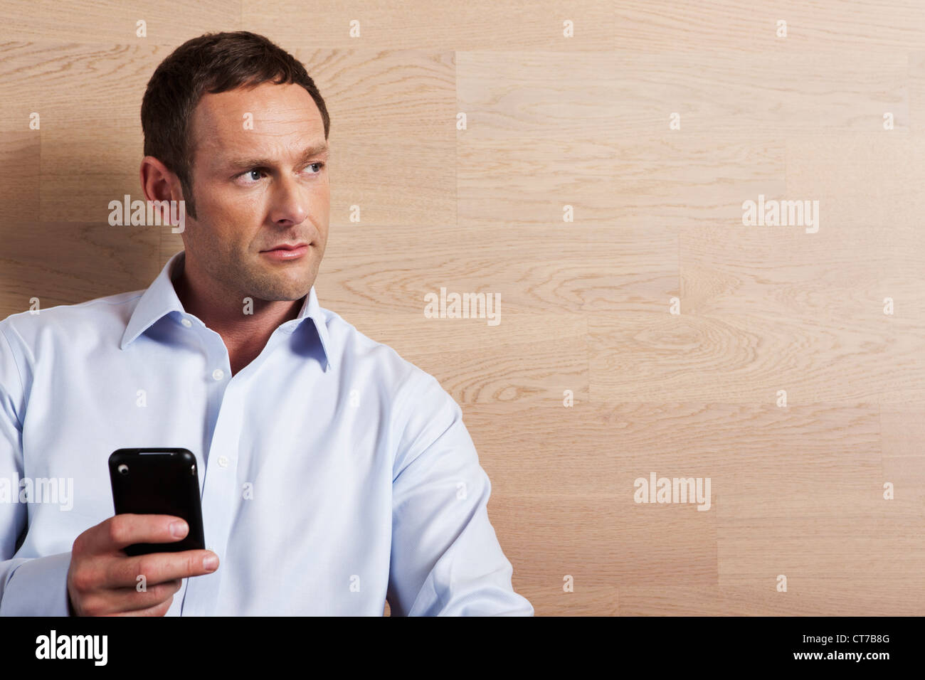 Mid adult man texting, portrait Stock Photo