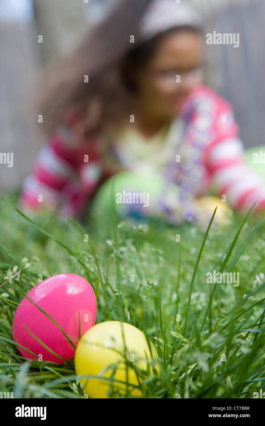 Girl looking for easter eggs in grass Stock Photo Alamy
