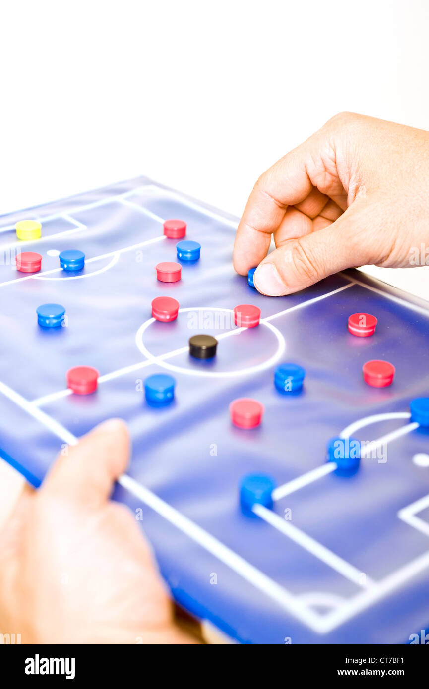 soccer trainer hand, showing schemes on a tactic board Stock Photo