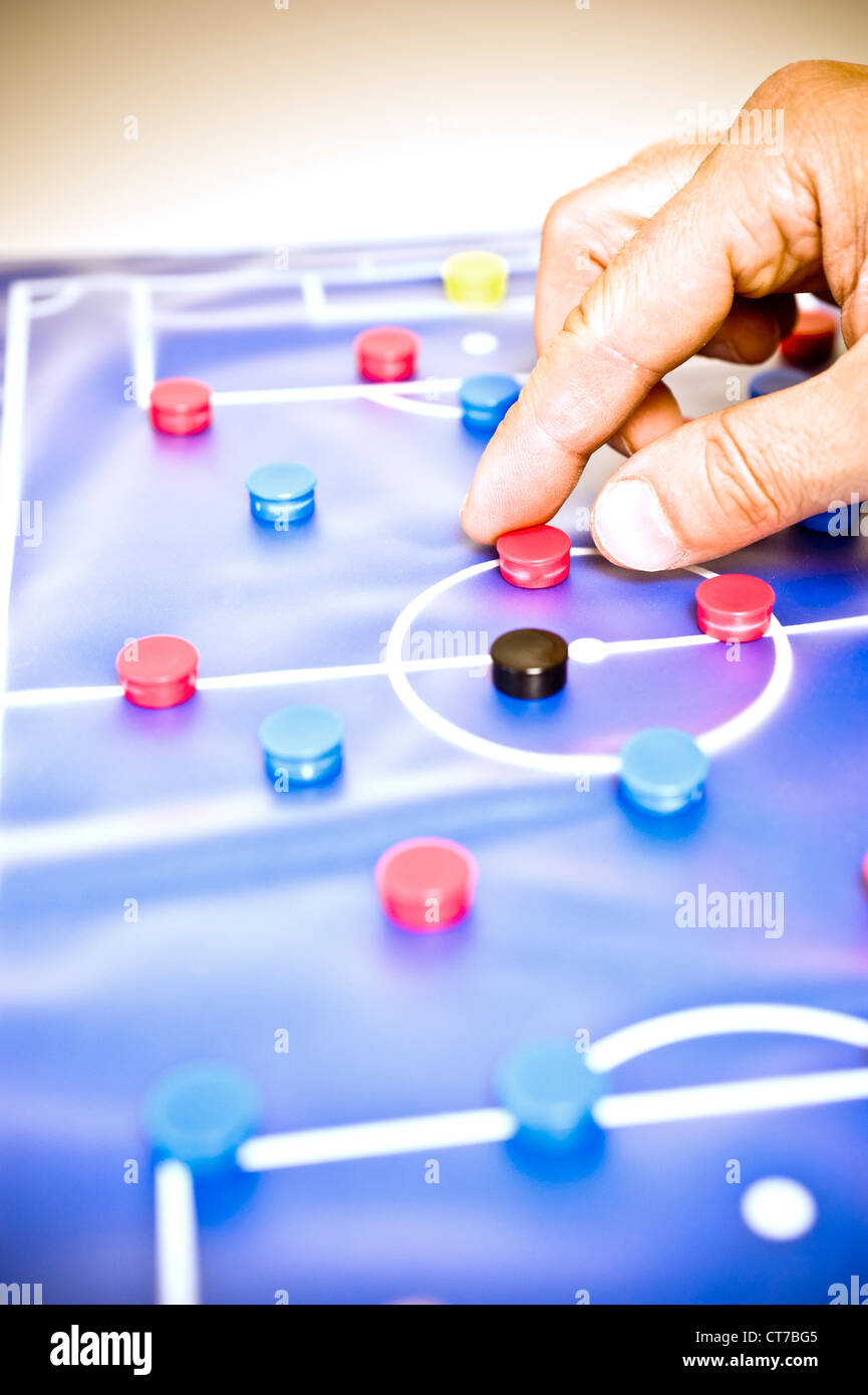 soccer trainer hand, showing schemes on a tactic board Stock Photo