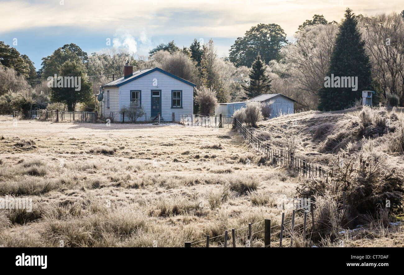 frosty morning house smoke fire Stock Photo