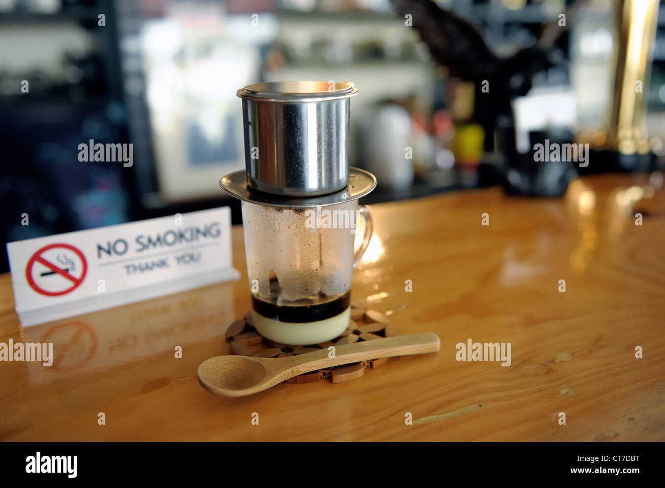A local café in Okinawa, Japan proudly serves Vietnamese coffee while kindly asking patrons to refrain from smoking. Stock Photo