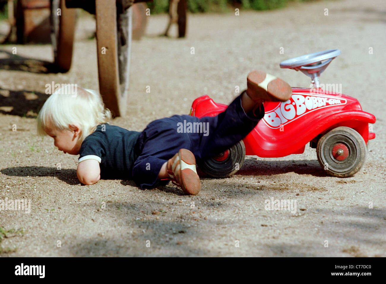 One child from his crashes BobbyCar Stock Photo - Alamy