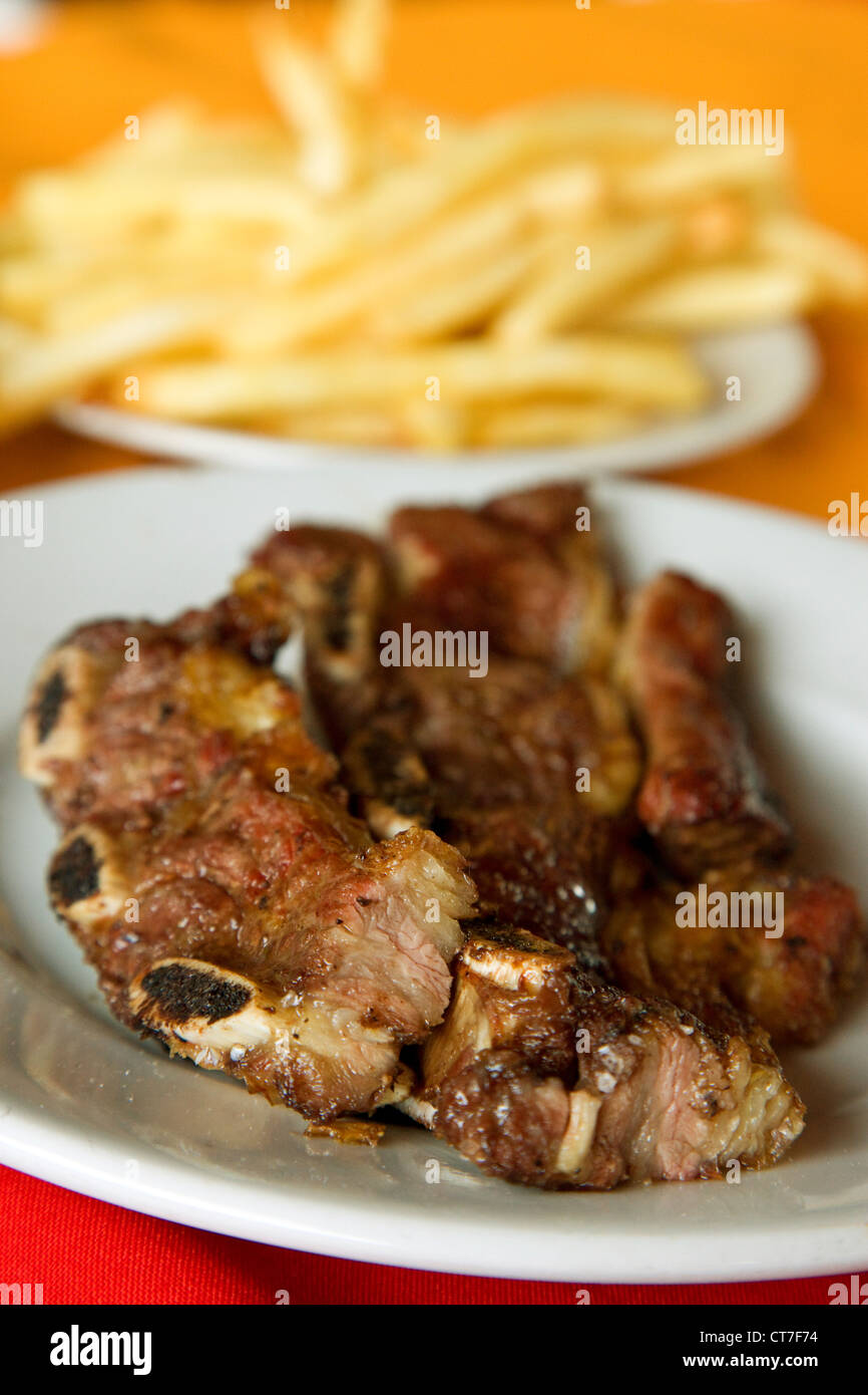 Beef cooked on an asado in a steak house Stock Photo Alamy