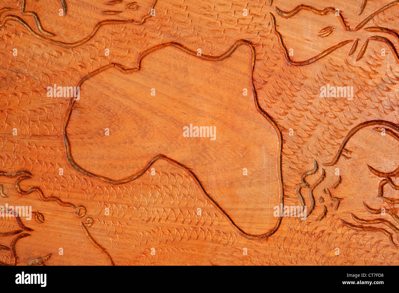 Shape of the African continent and African animals carved in wood Stock Photo