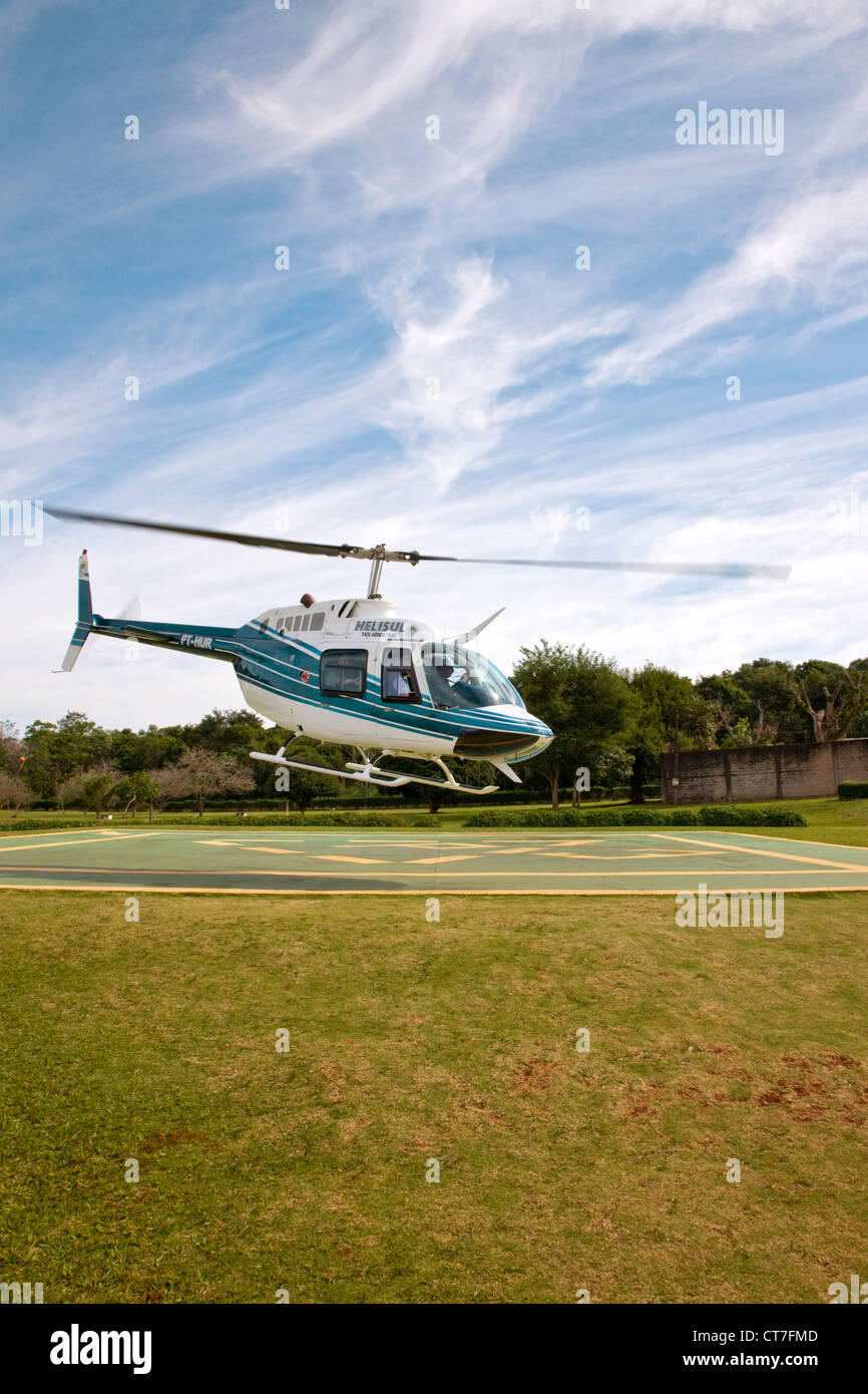 Helicopter taking off for flight over Iguacu Waterfalls Stock Photo