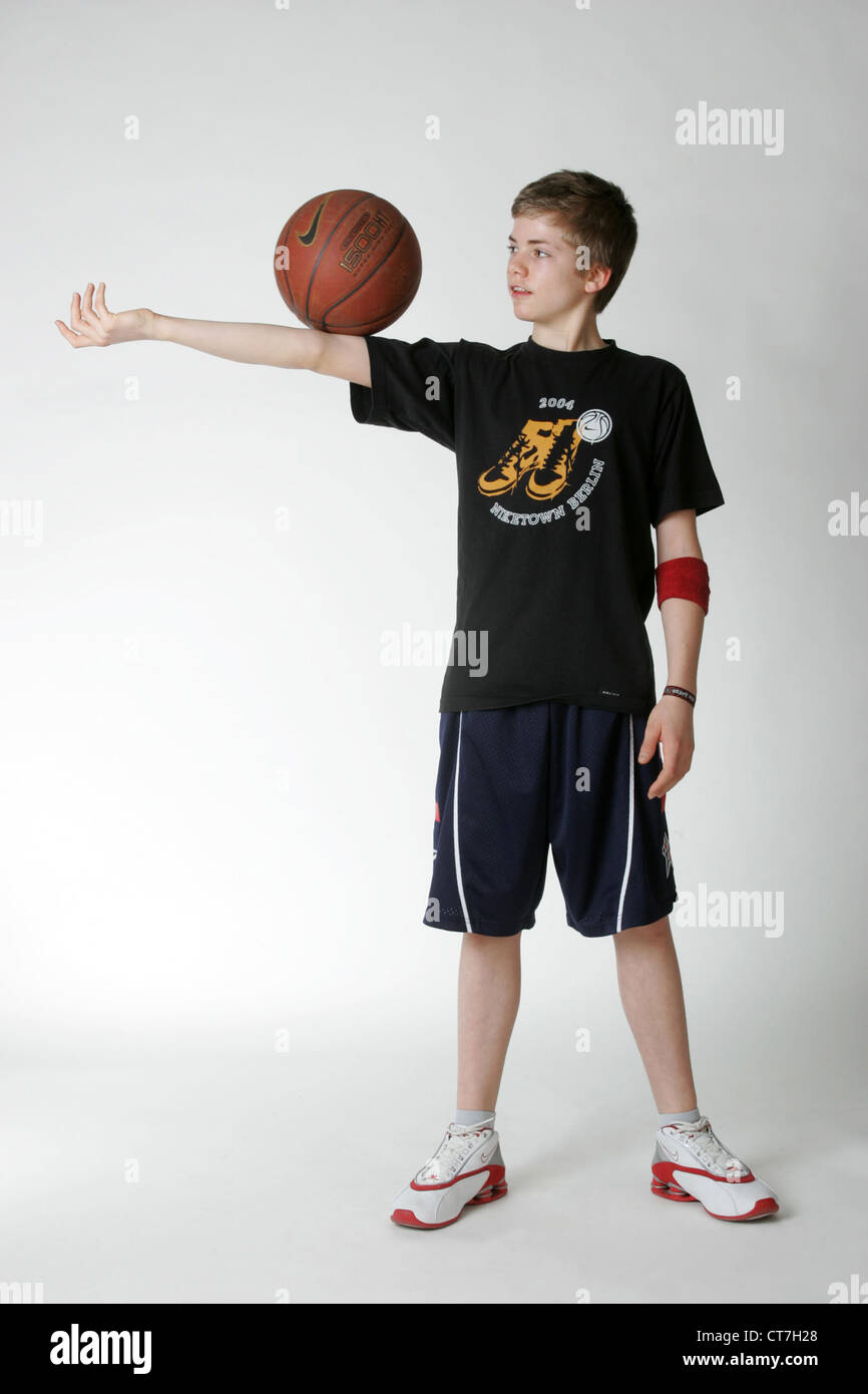 A boy juggling with a basketball Stock Photo Alamy