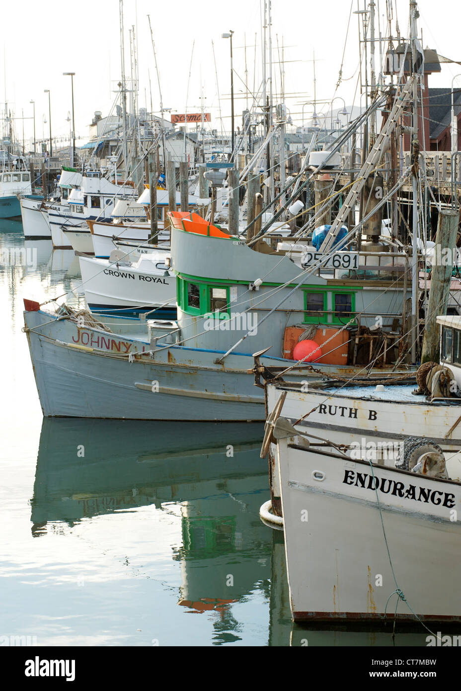 Fishing boats moored in Fish Alley in the Fisherman's Wharf waterfront in San Francisco, California, USA. Stock Photo