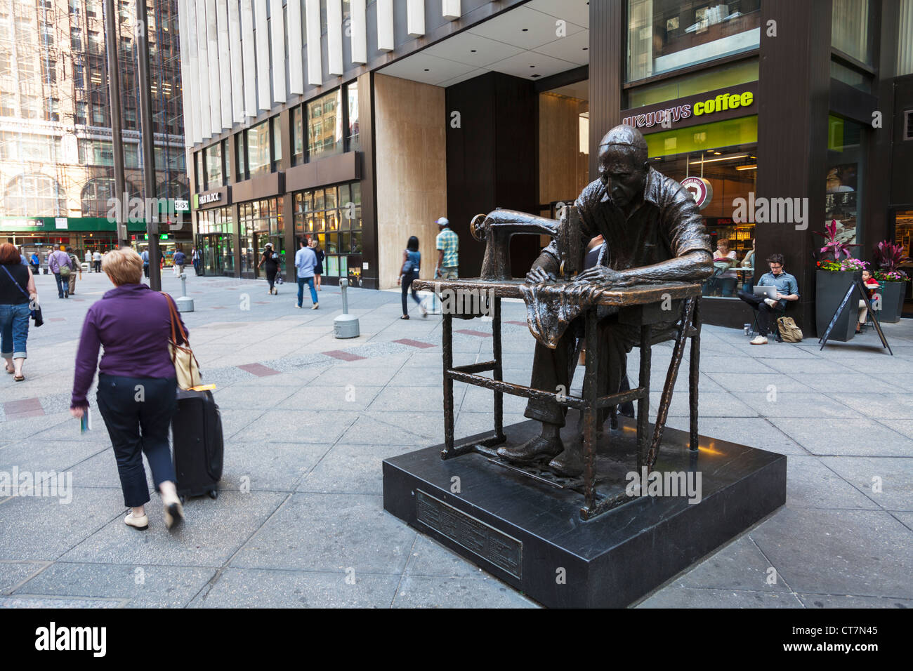 Manhattan New York City Garment District with huge statue of man