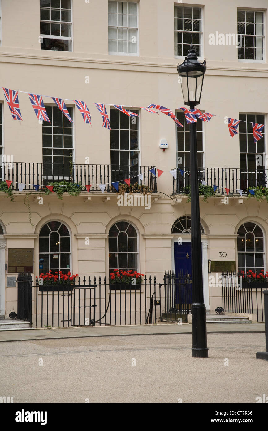 houses in London's Fitzroy Square with Union Jack bunting