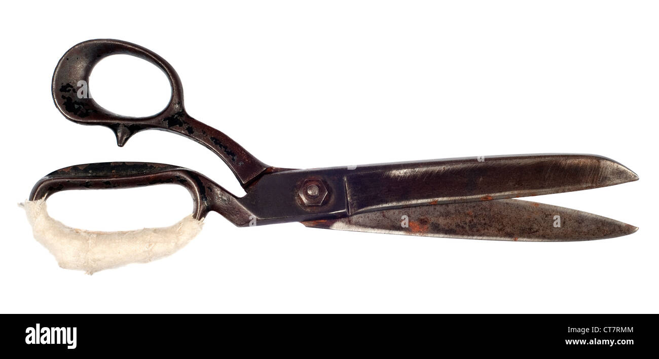 Old and rusty Dressmaking tailor scissors isolated over white background Stock Photo