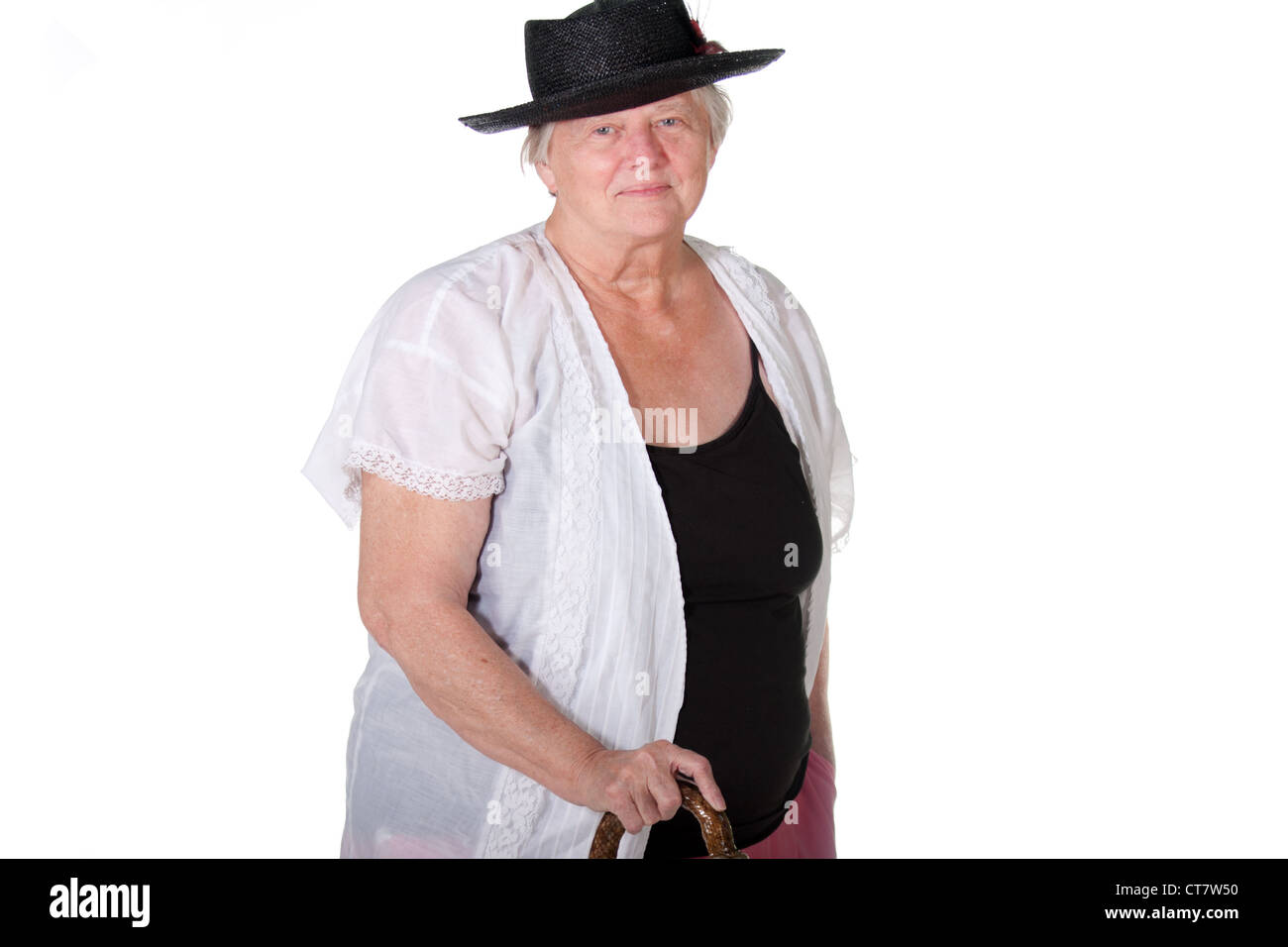 Senior woman with cane and hat smiling Stock Photo