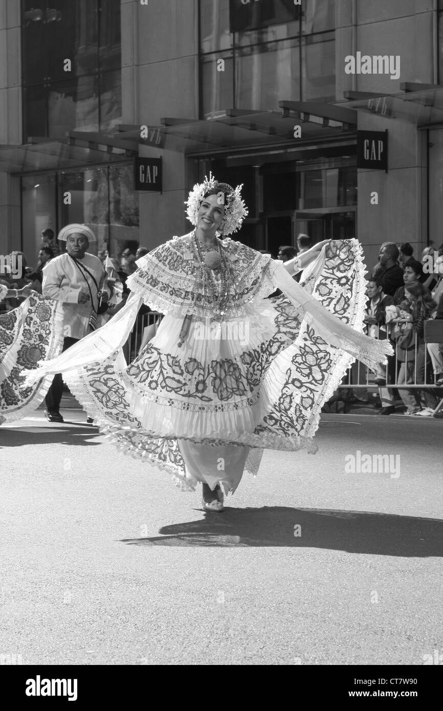 folk dancers perform in a flower parade on Central Park West in New York NY Stock Photo