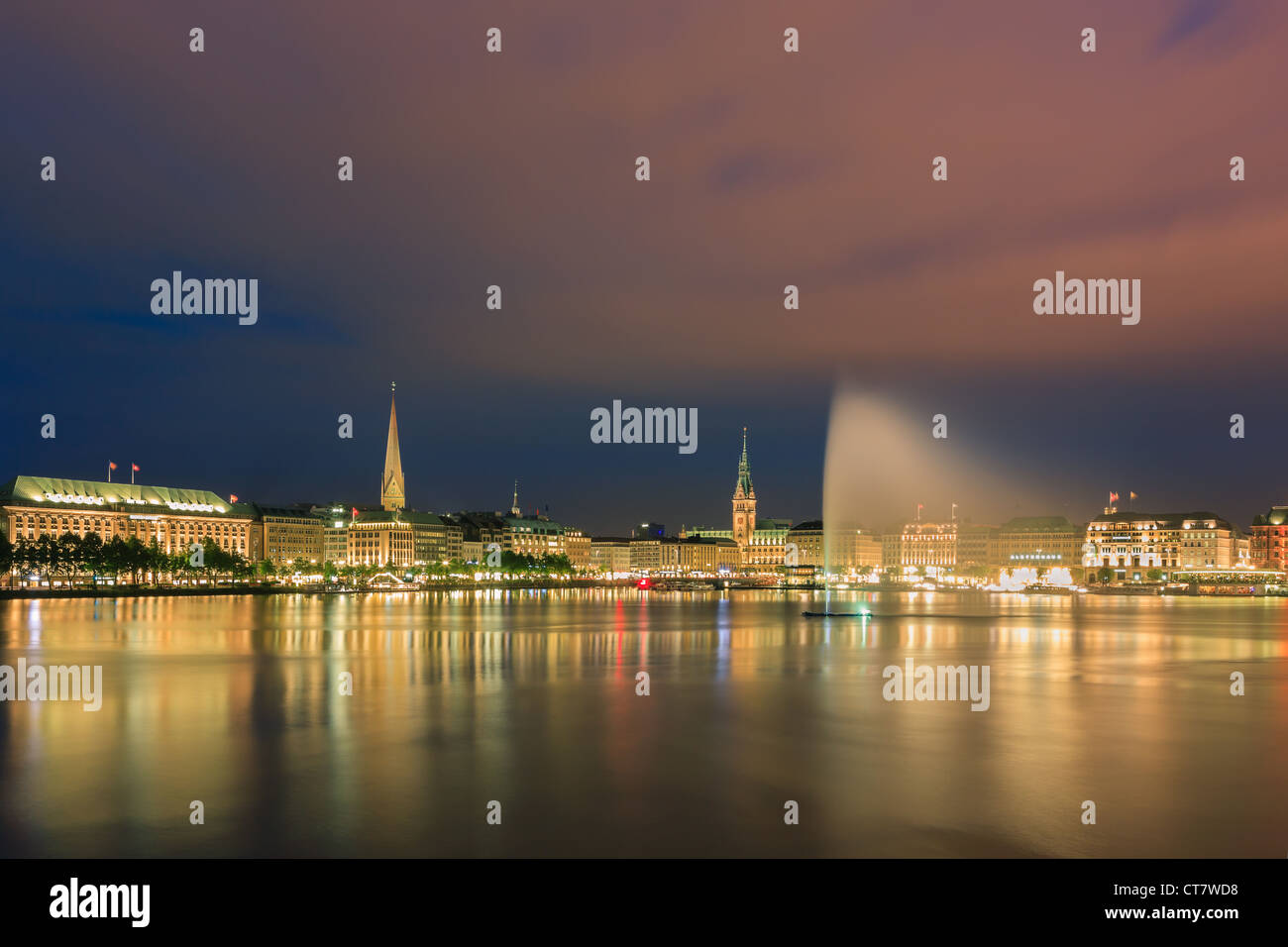 Hamburg skyline taken right after sunset at the blue hour over the binnenalster. Stock Photo