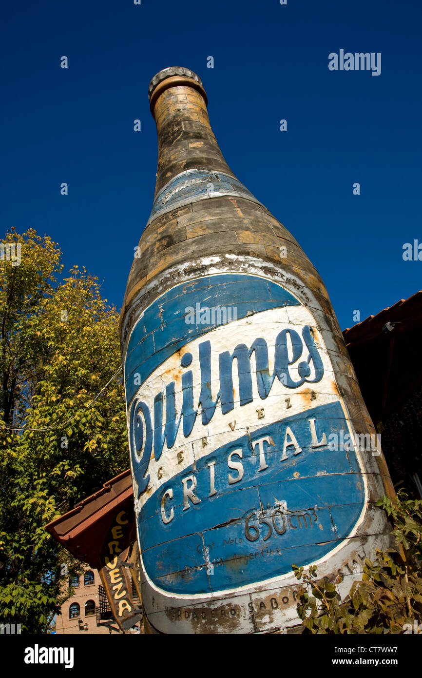 Detail of large wooden Quilmes beer bottle Stock Photo