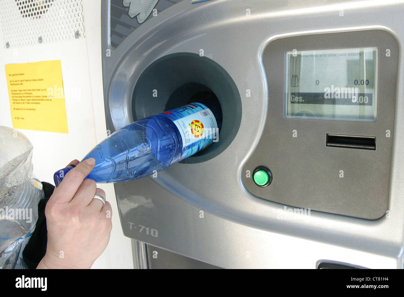 Hand puts bottle deposit machine Stock Photo Alamy