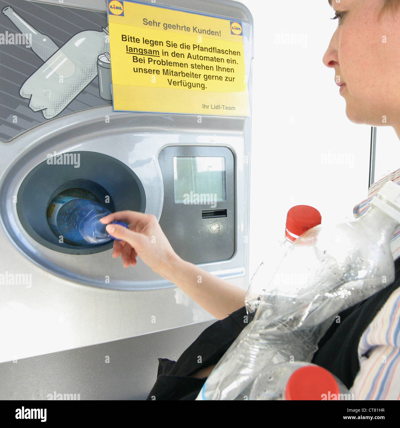 Female lays bottle deposit machine Stock Photo Alamy