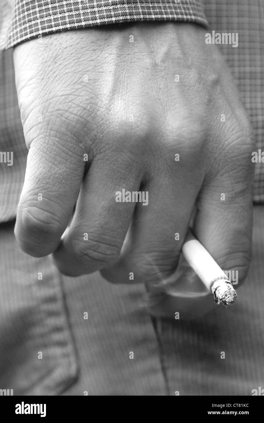 Maennerhand with cigarette Stock Photo