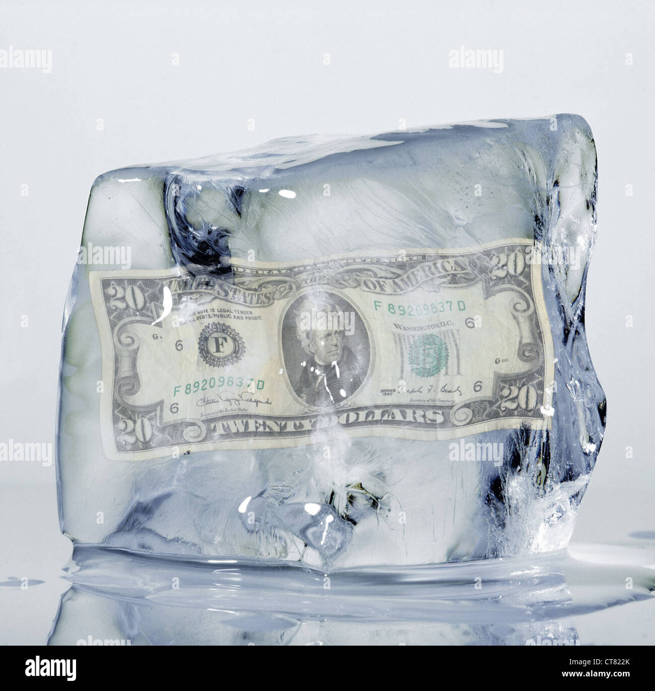 Ice Cube with dollar bill Stock Photo Alamy