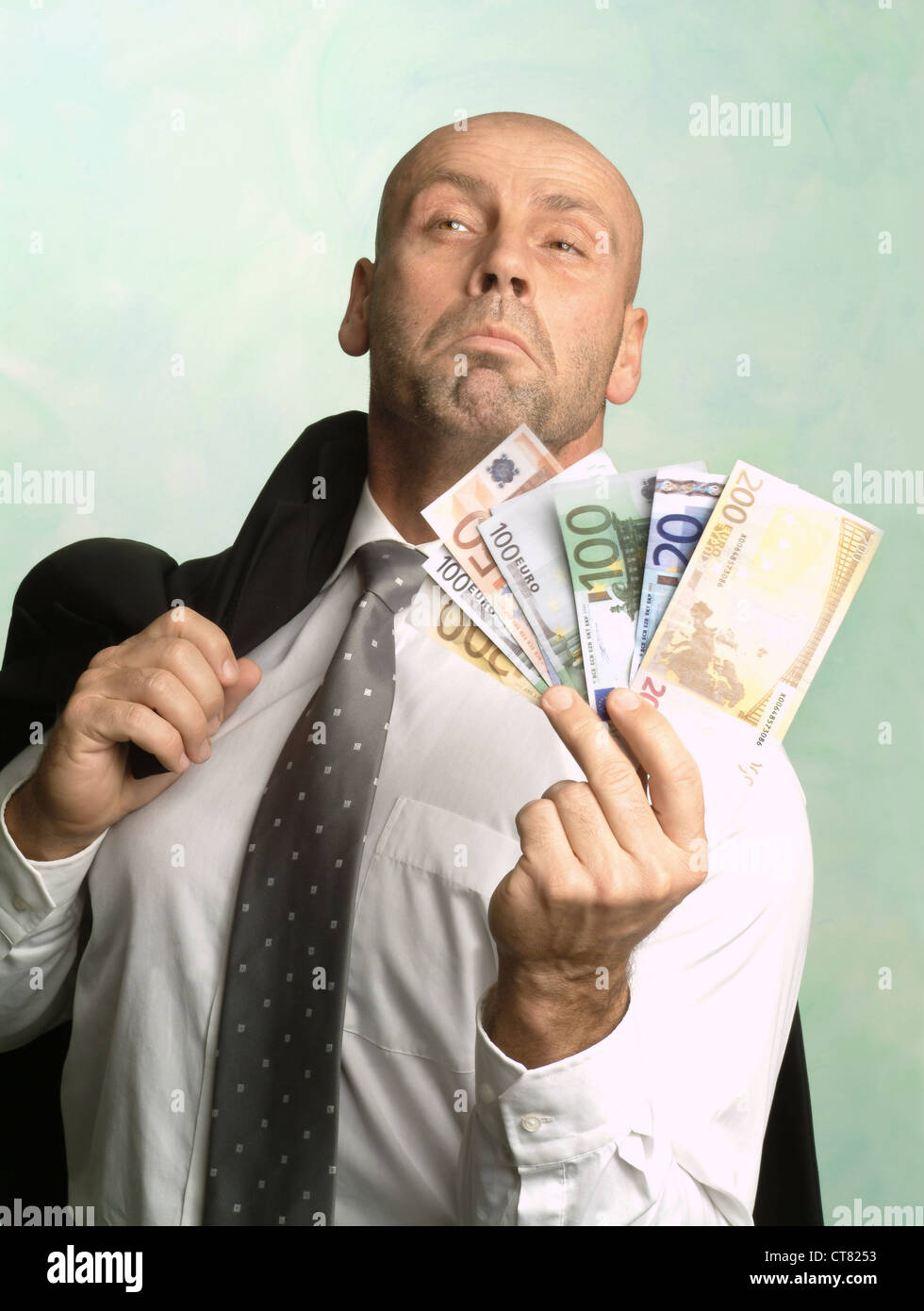arrogant man posing with euro notes stock photo alamy https www alamy com stock photo arrogant man posing with euro notes 49349807 html