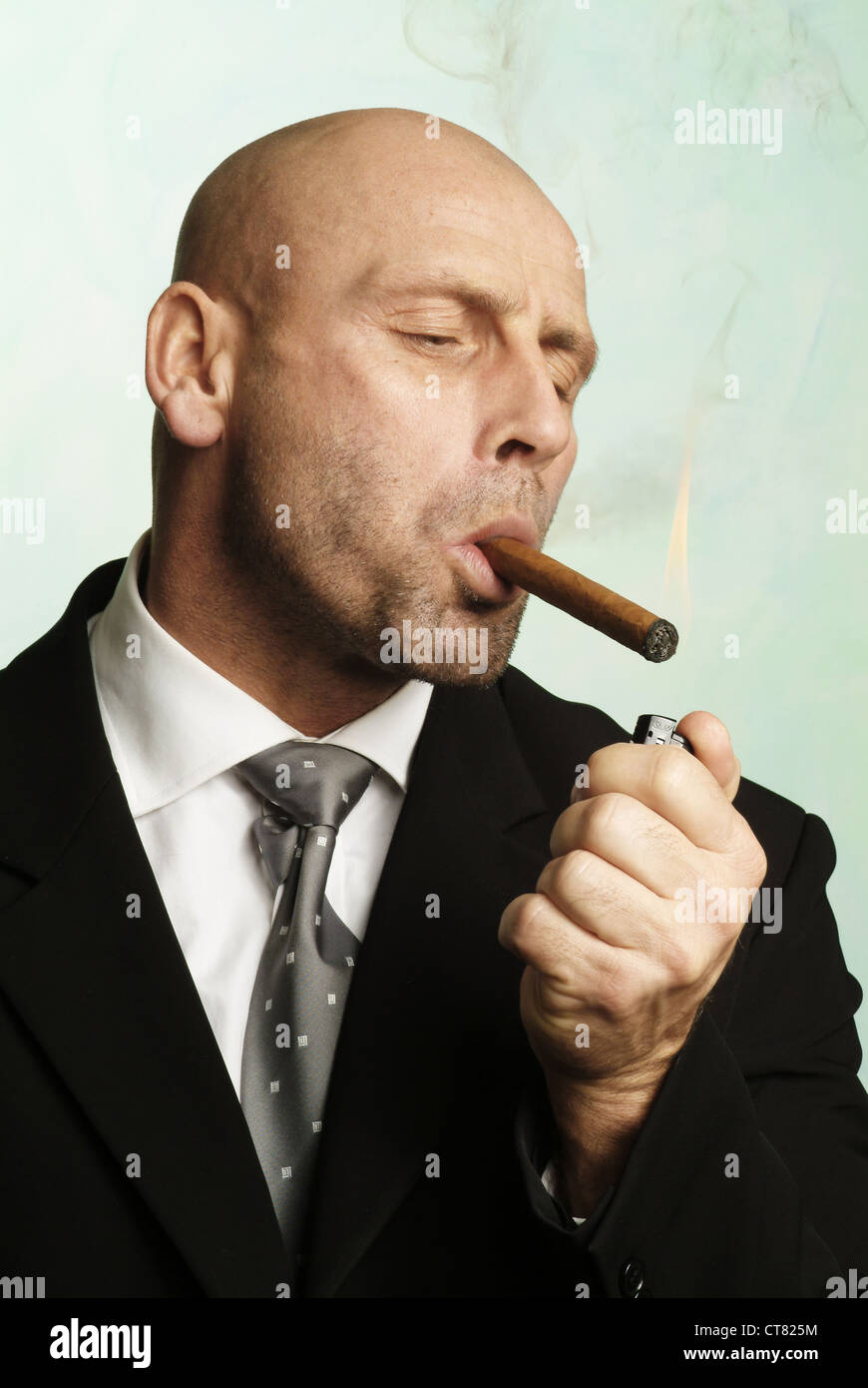 Man builts on pleasurable cigar Stock Photo