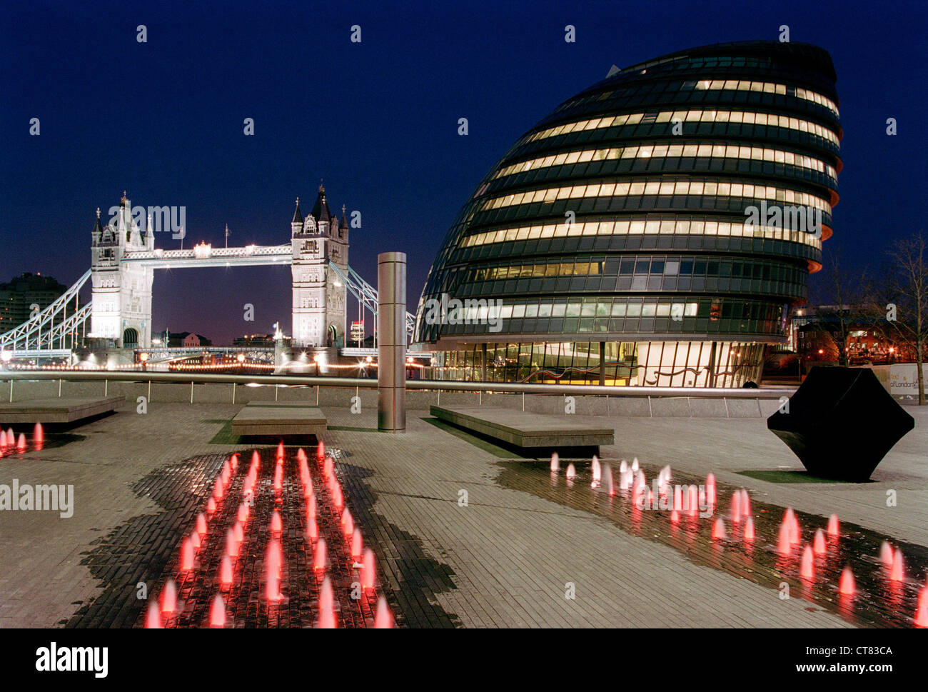 London - City Hall and Tower Bridge illuminated at night Stock Photo