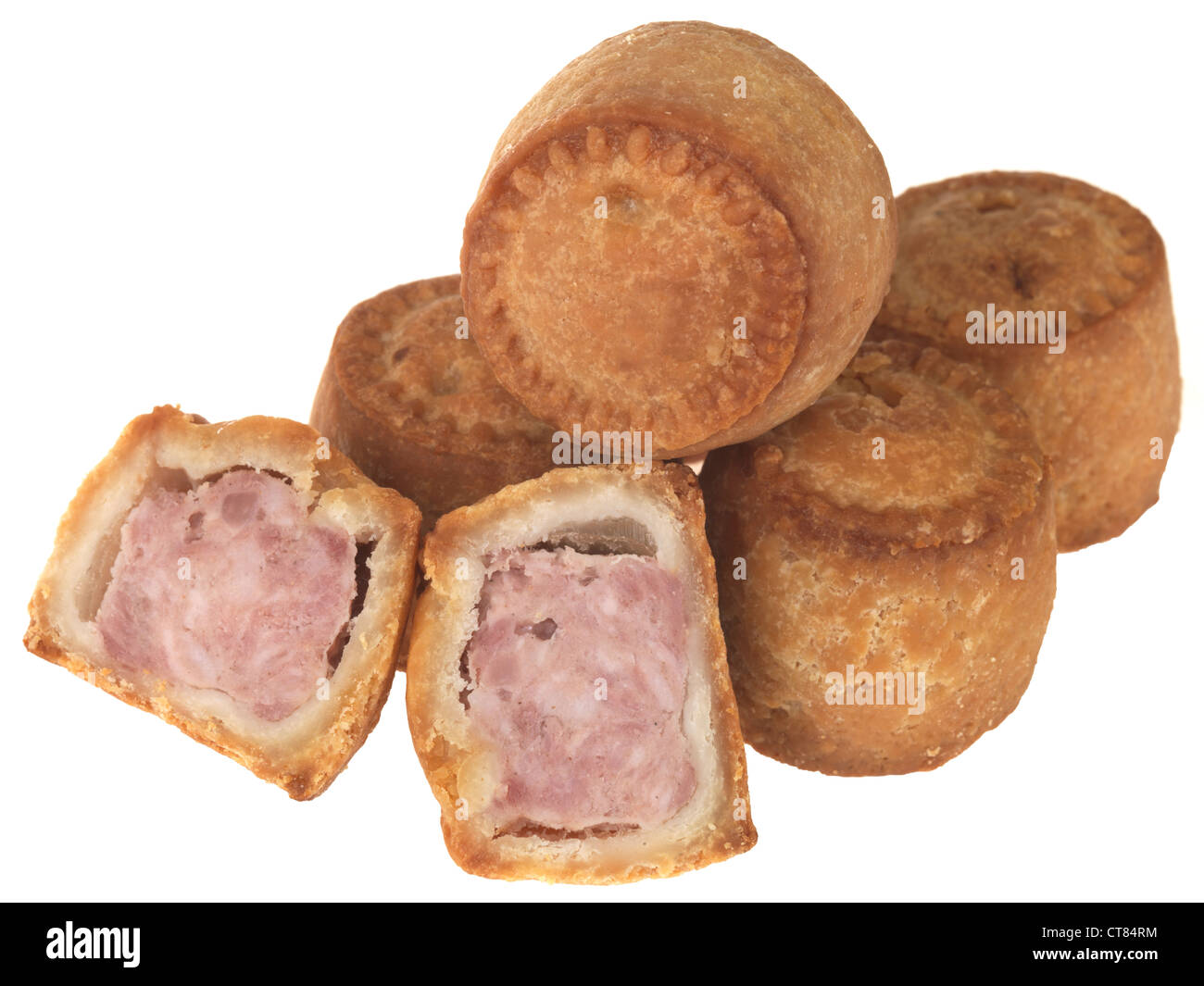 Fresh Traditional British Pork Pies In Crusty Pastry Ready To Eat, Isolated Against A White Background, With A Clipping Path And No People Stock Photo