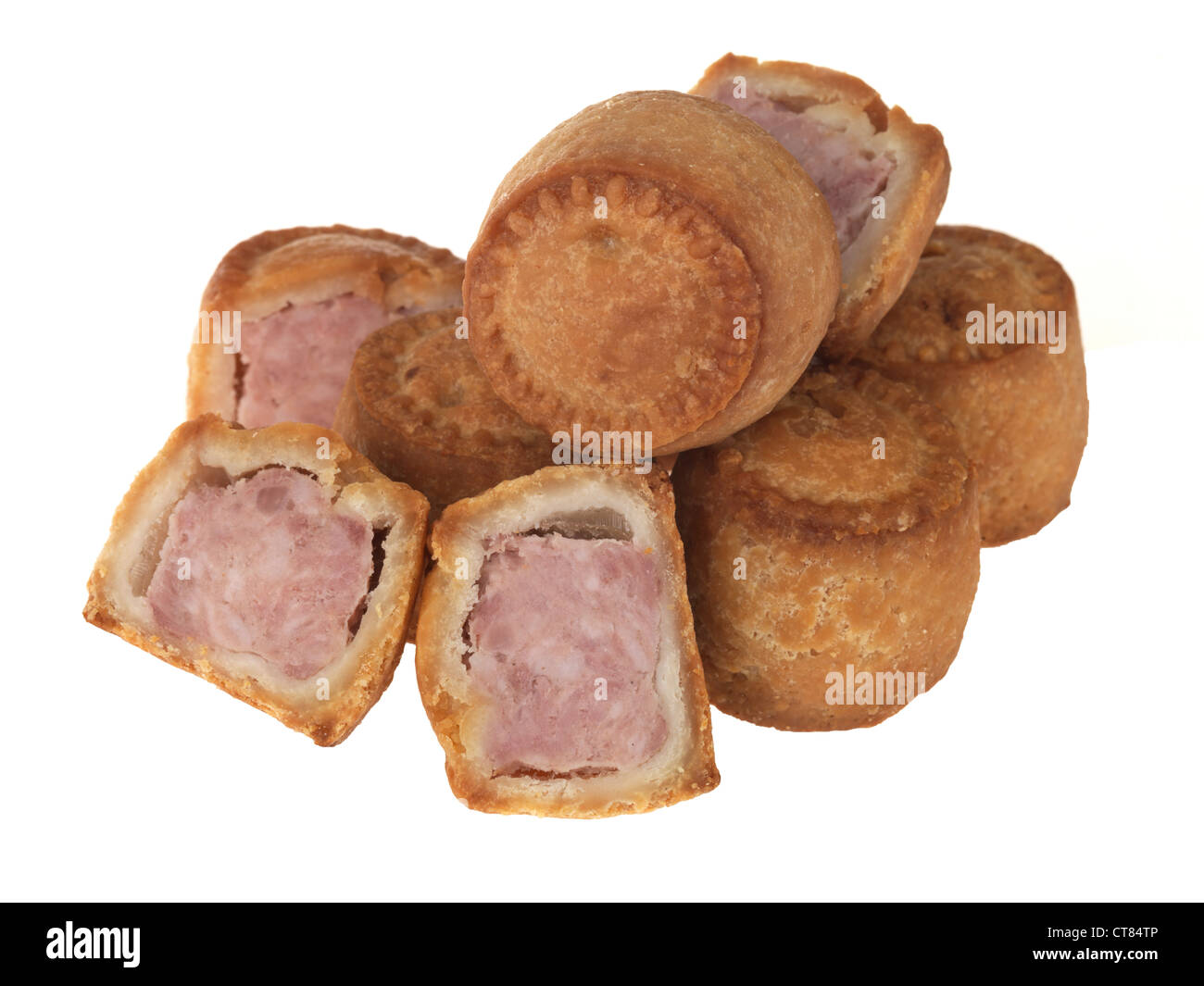 Fresh Traditional British Pork Pies In Crusty Pastry Ready To Eat, Isolated Against A White Background, With A Clipping Path And No People Stock Photo