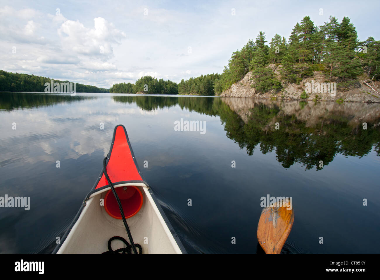 Canoe on a quiet lake in Sweden Stock Photo