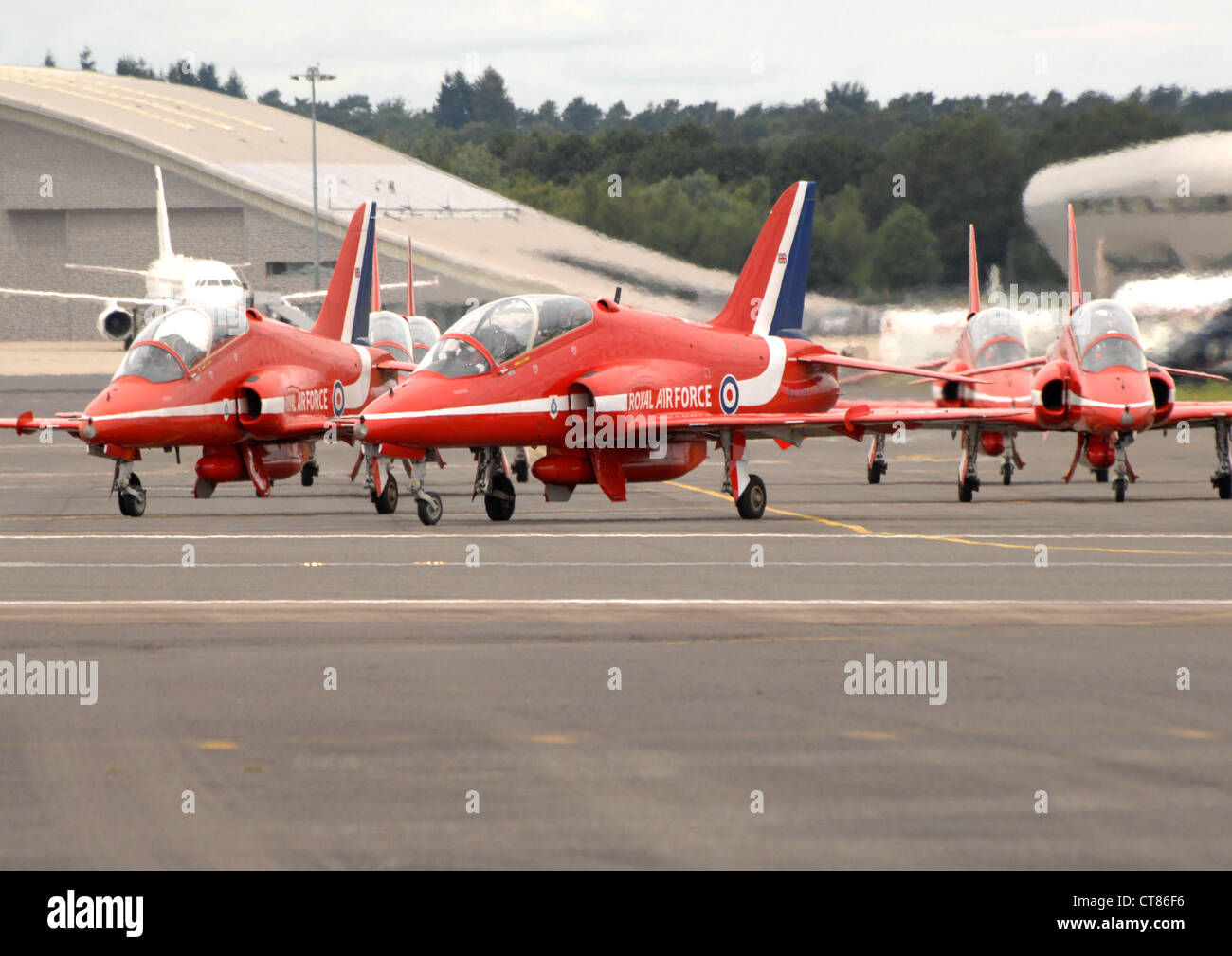 BAE Systems Hawk T1s of the RAF Red Arrows display team taxiing on the runway at Farnborough. England. Stock Photo