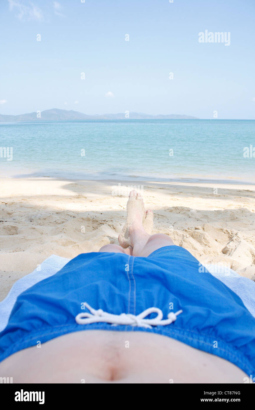 Legs on beach Stock Photo