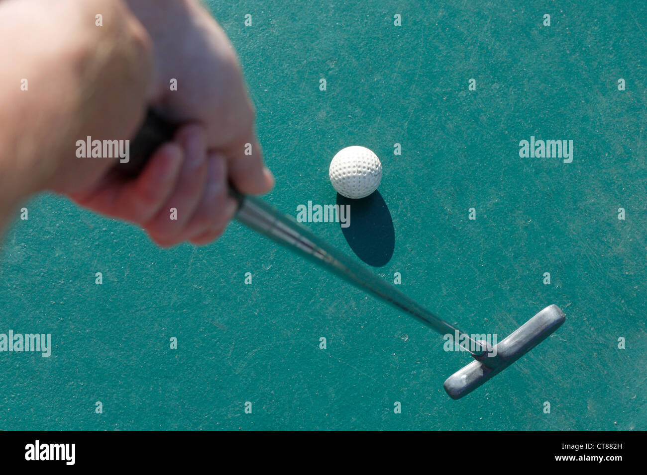 Playing miniature golf Stock Photo