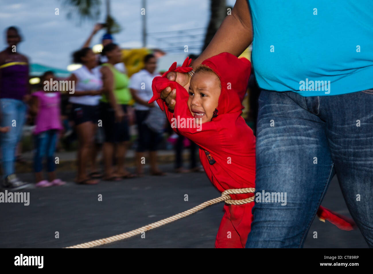 Small child dressed as a devil during Carnival celebrations on Isla Colon, Bocas del Toro, Panama. Stock Photo