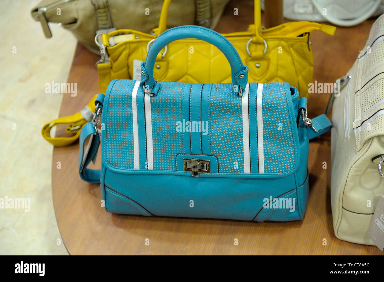 blue leather handbag in a souvenir shop menorca spain Stock Photo