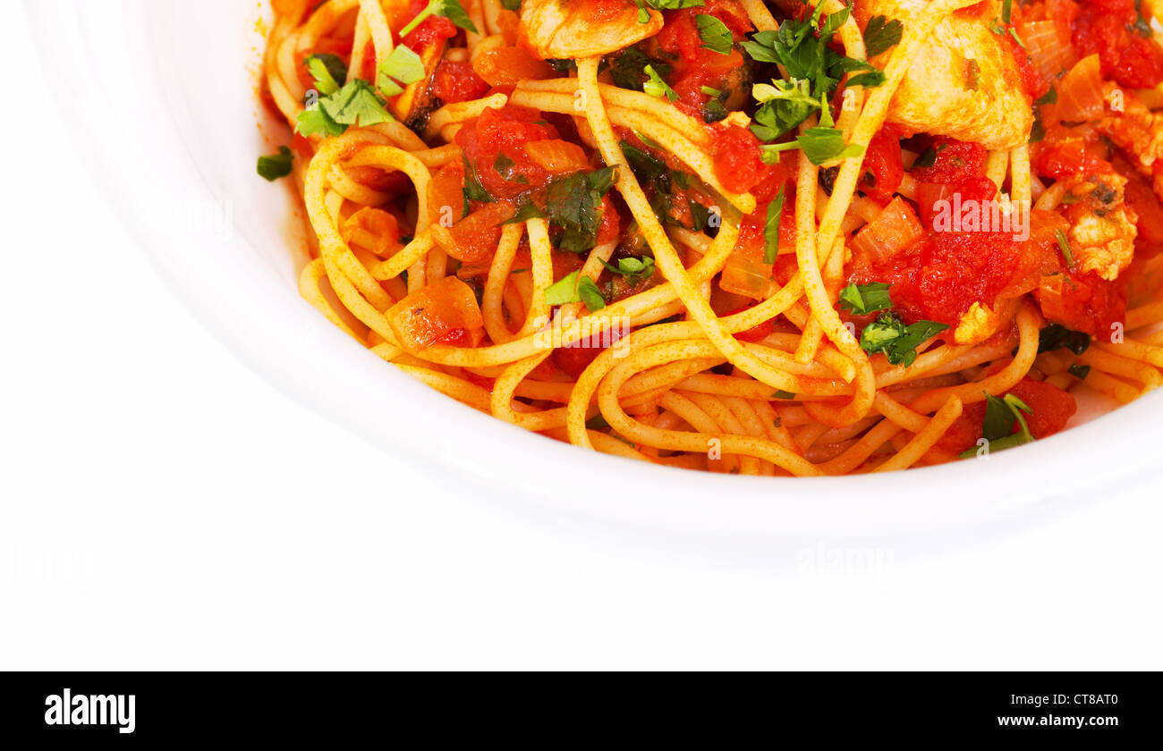 Spaghetti tomato seafood dish in white bowl from top view Stock Photo