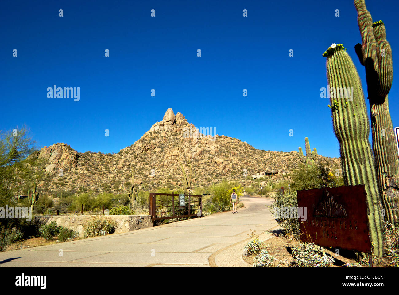 Woman entrance roadway gate Pinnacle Peak Regional Park Scottsdale Arizona Stock Photo