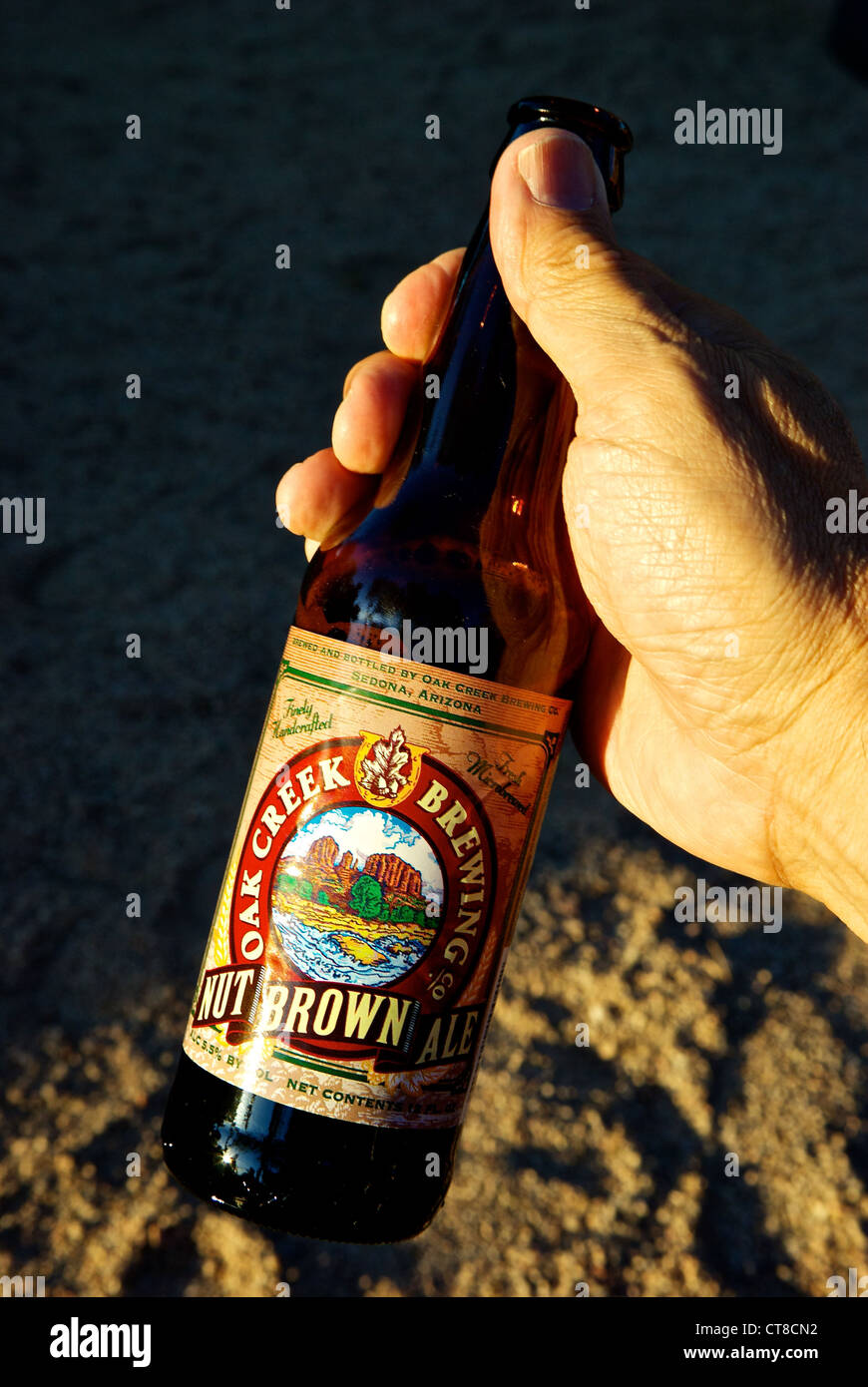 Hand holding bottle Oak Creek Brewing Company microbrewery Nut Brown