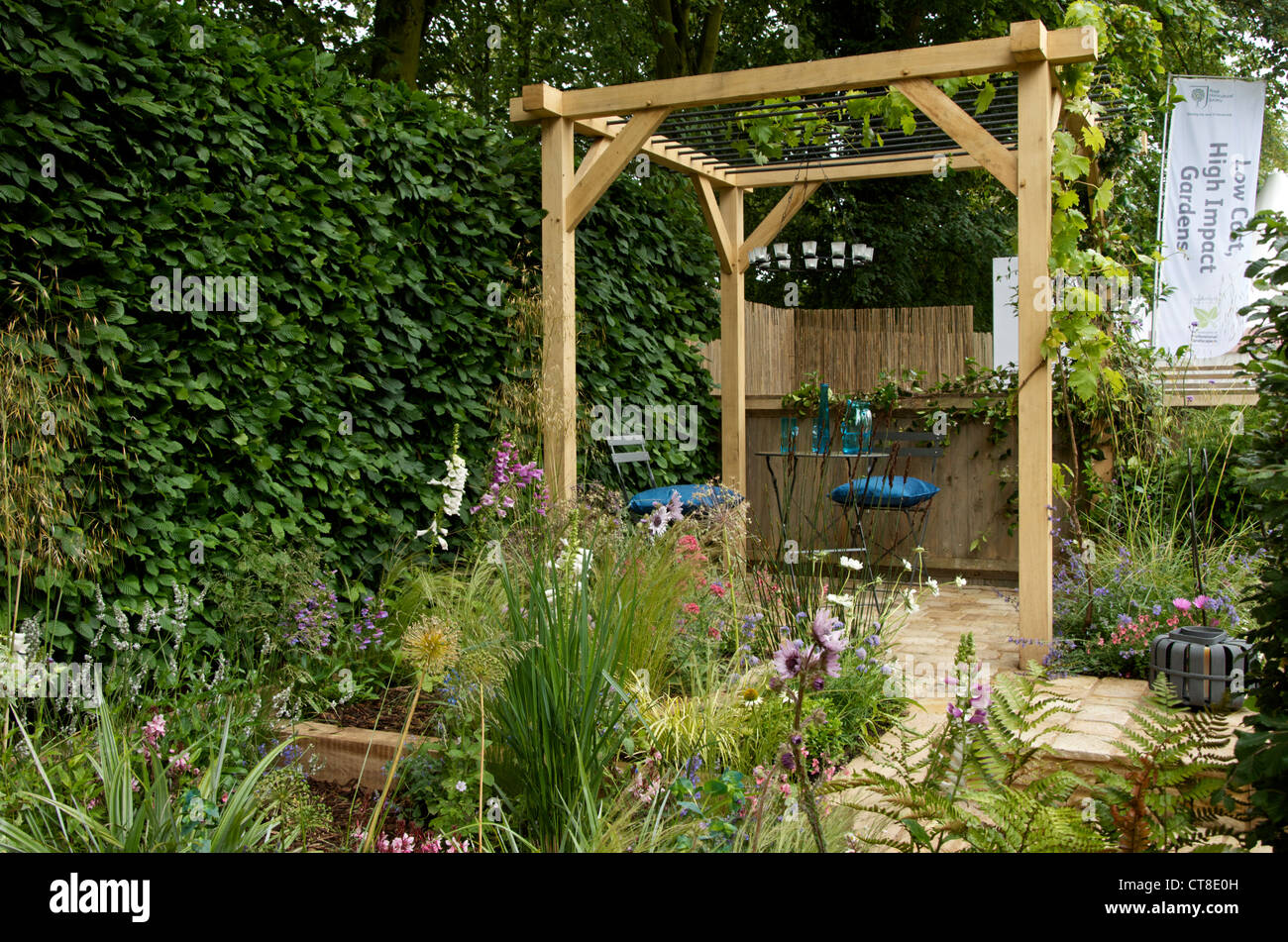A Compromising Situation Garden at RHS Hampton Court Palace Flower Show London UK 2nd July 2012 designed by Richard Wanless Stock Photo