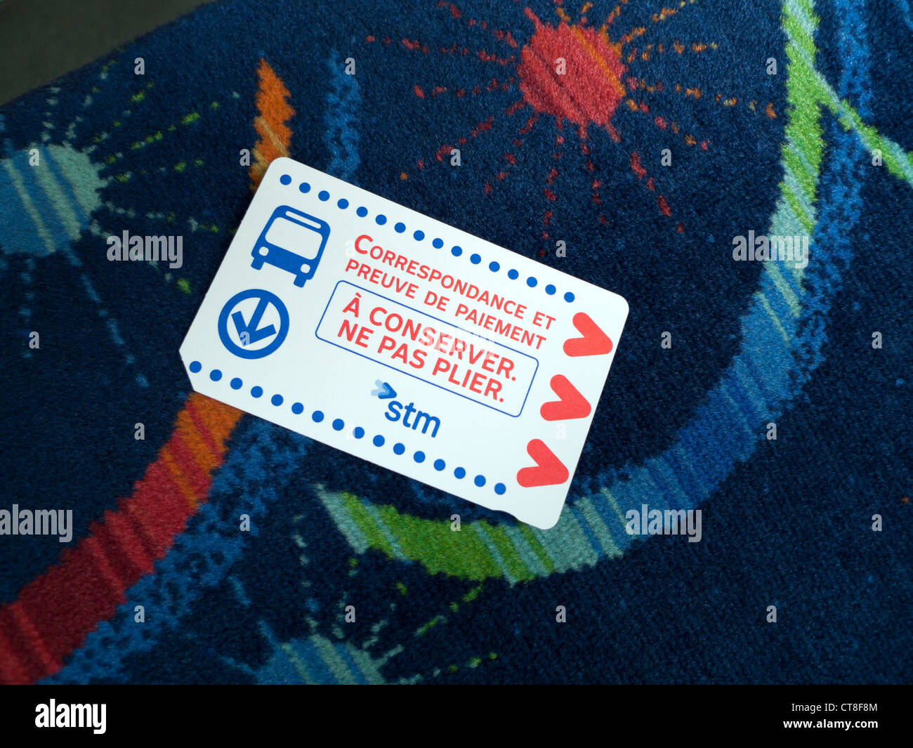 A French language bus ticket on the upholstery of the public transport system bus service in Montreal, Quebec, Canada  KATHY DEWITT Stock Photo