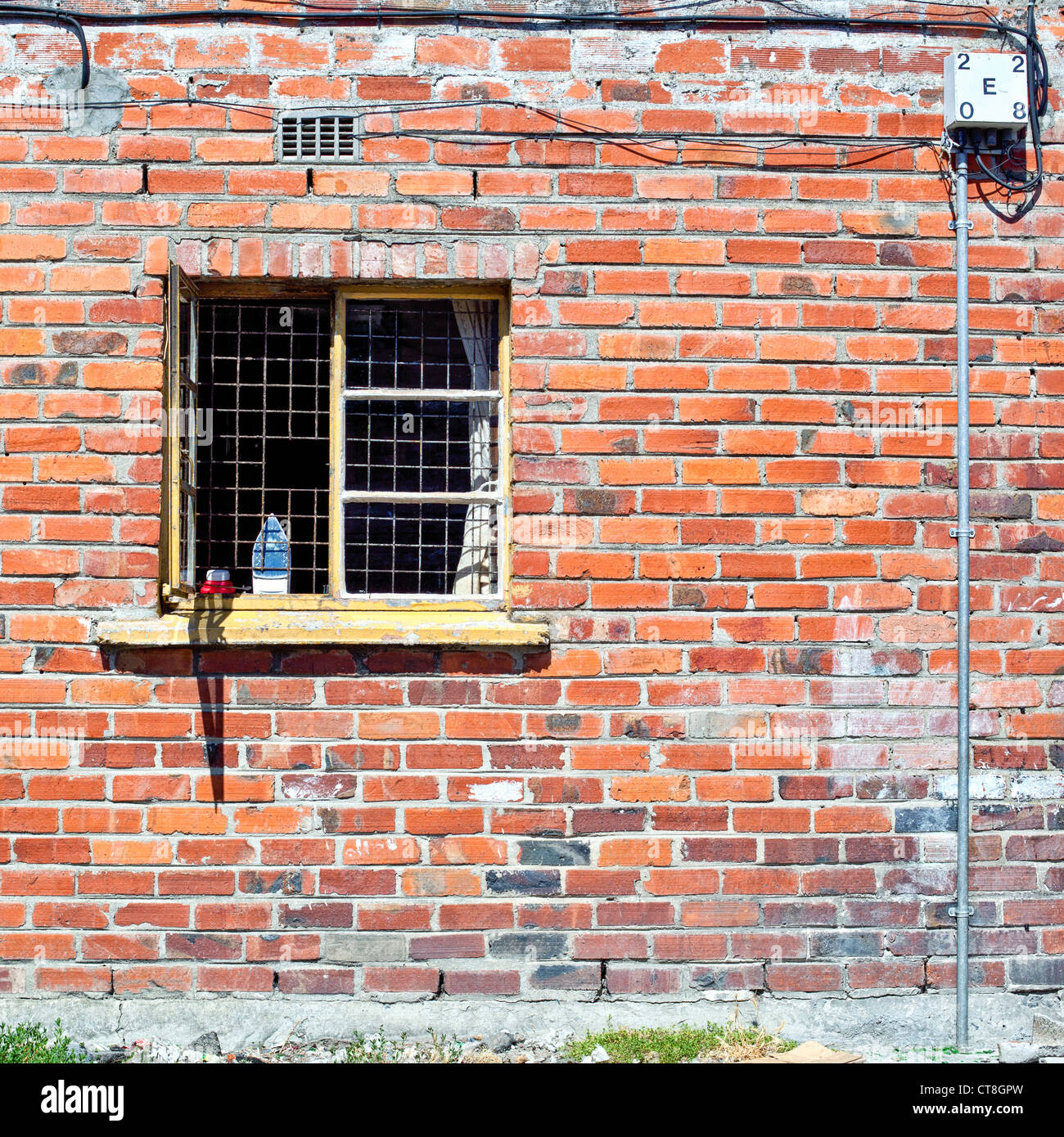 A window with burglar proofing in Langa African Township near Cape Town