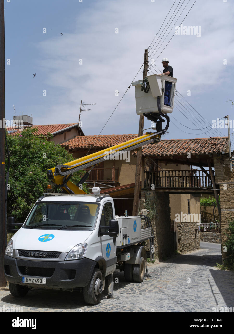 dh  KAKOPETRIA CYPRUS AIK Electricity engineer fixing lines Old Troodos mountain village cypriot Stock Photo
