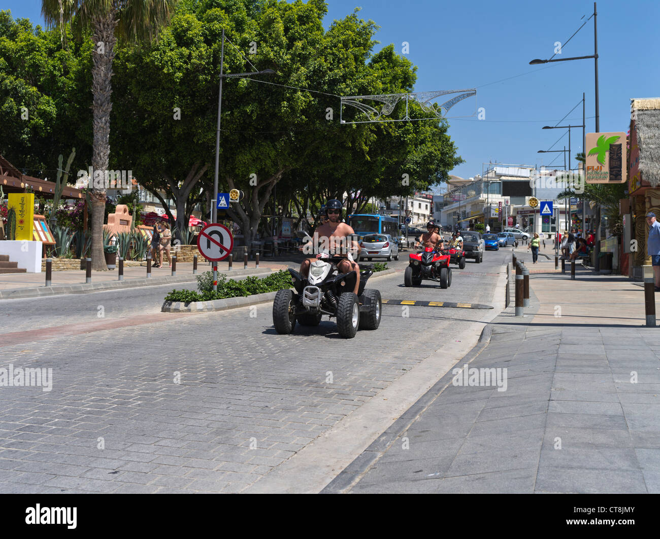 dh  AYIA NAPA SOUTH CYPRUS Tourist youngsters driving quadbikes quad bike youth quadbike vacation tourists holiday island Stock Photo