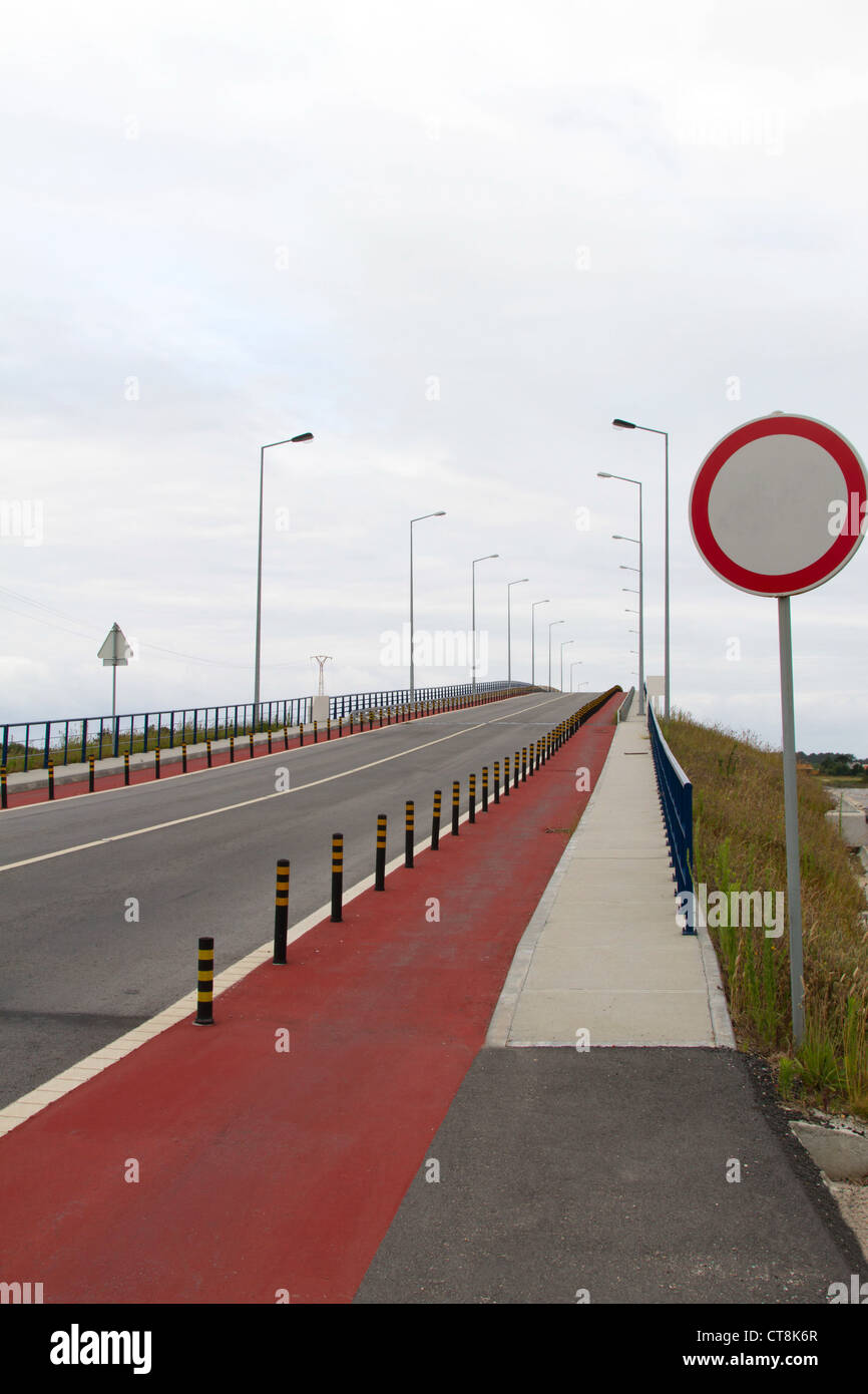Cycle path on a bridge road, with blank sign post Stock Photo - Alamy