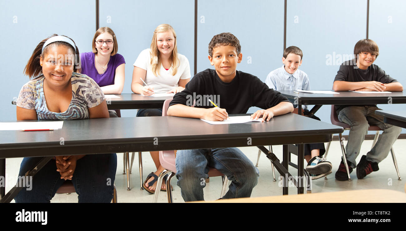 Diverse group of teenage school children in class. Wide angle banner.  Stock Photo