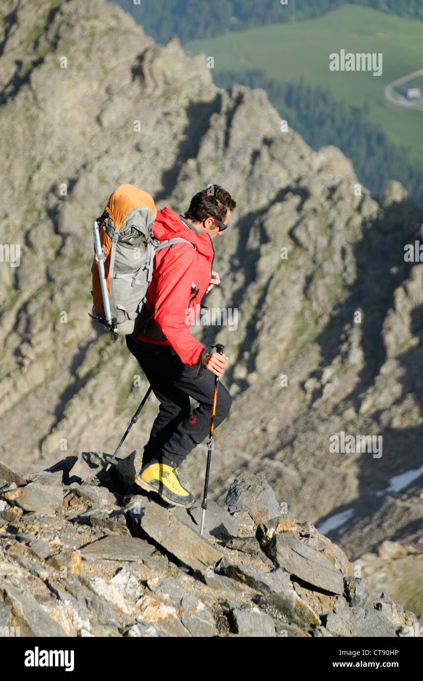 A Mountain Guide running down a mountain path Stock Photo Alamy